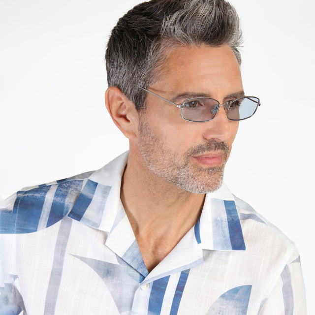Model with salt and pepper beard looking left wearing Flushing Sunglasses Silver with Light Blue Flat See Through