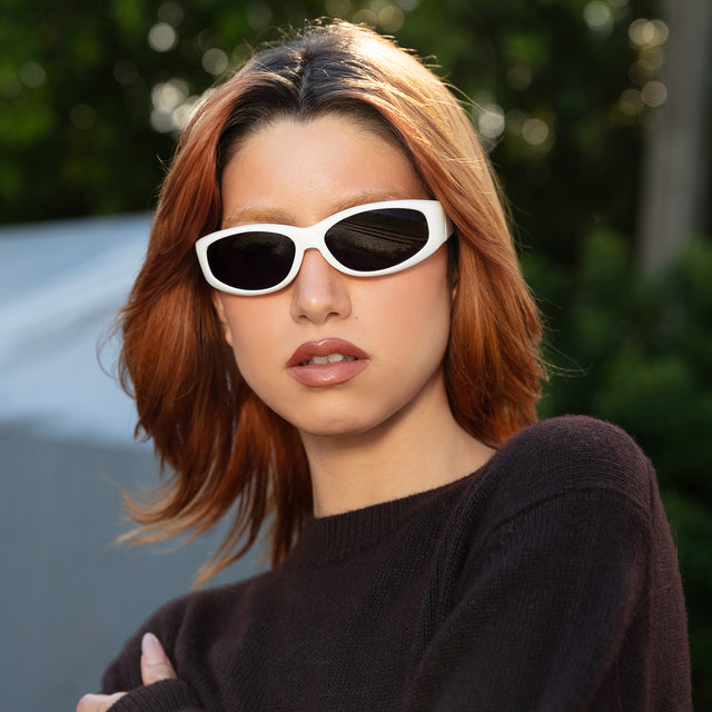 Red-haired model wearing Granada Sunglasses White with Grey