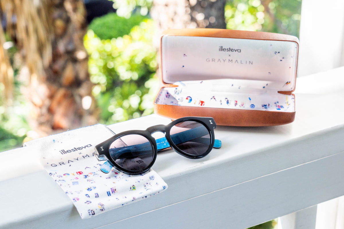 Gray Malin x illesteva shown in Leonard Ocean next to the Gray Malin custom case