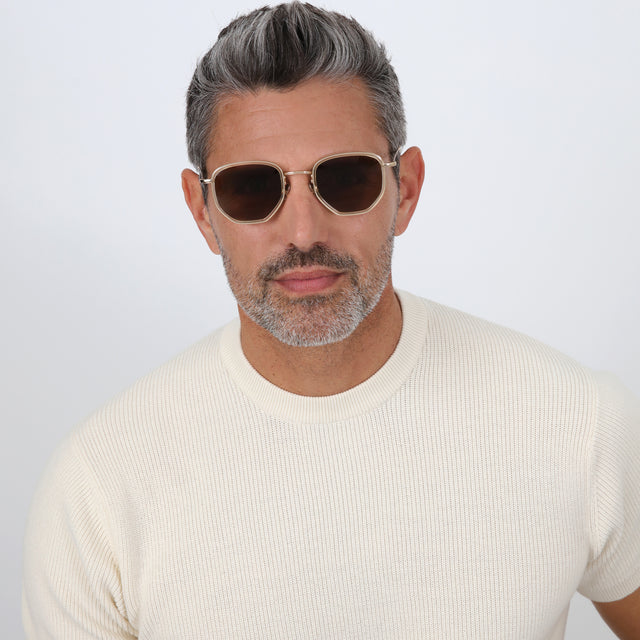 Model with salt and pepper hair and beard wearing Hunter Ace Sunglasses Champagne/Gold with Brown