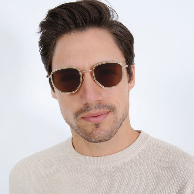 Model with short brown hair wearing Hunter Ace Sunglasses Champagne/Gold with Brown
