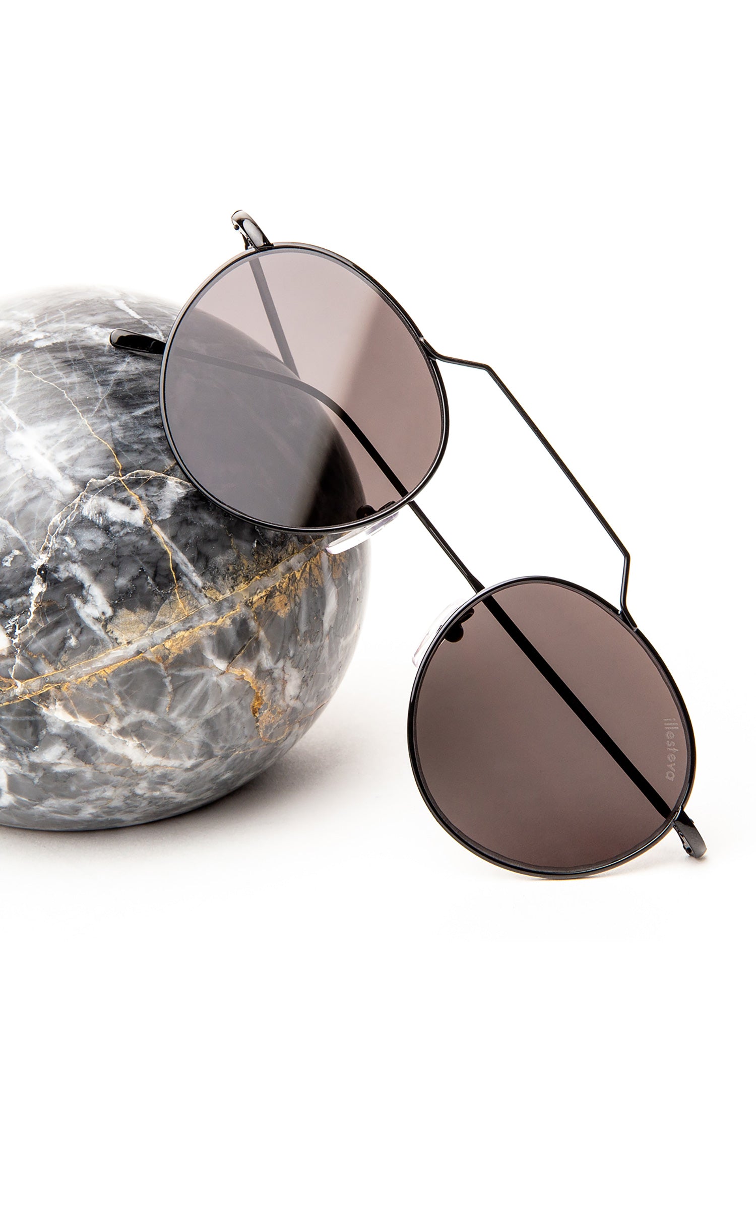 Wynwood in Black displayed over a marble sphere