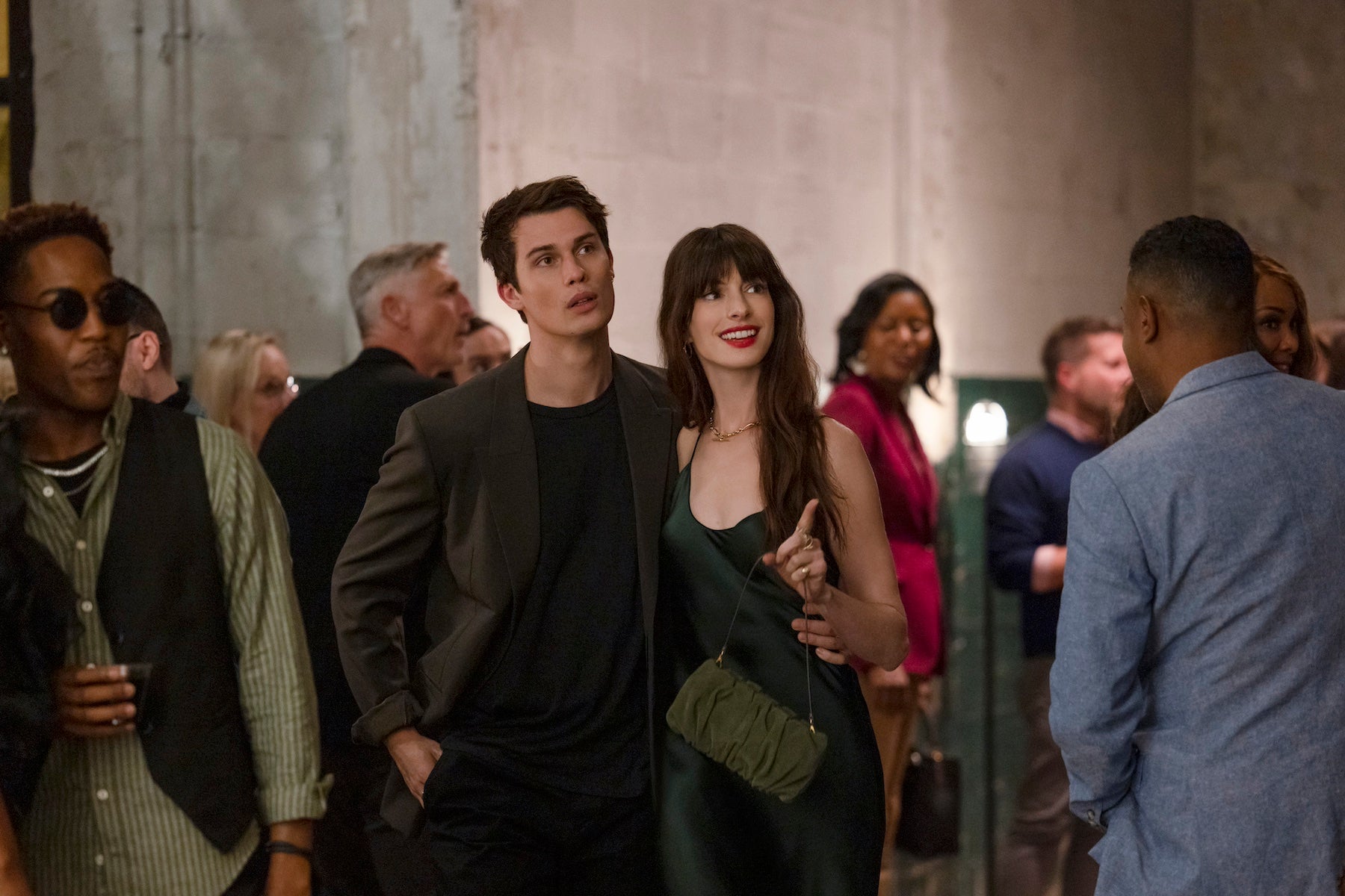 Still from 'The Idea of You' featuring Anne Hathaway and Nicholas Galitzine at a formal gathering