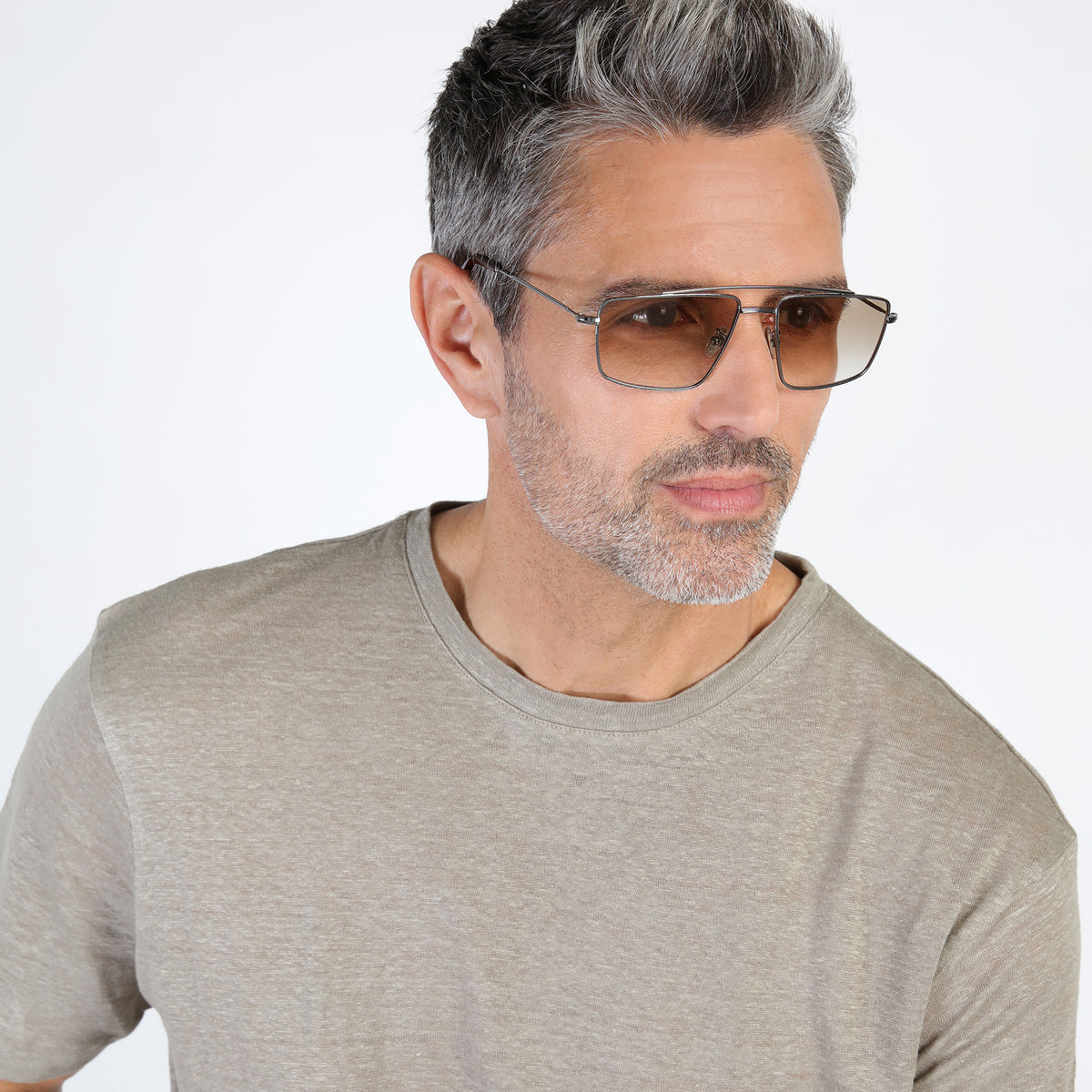 Man wearing Jane Sunglasses in Gunmetal with Taupe Gradient lenses, Model with salt and pepper beard looking left