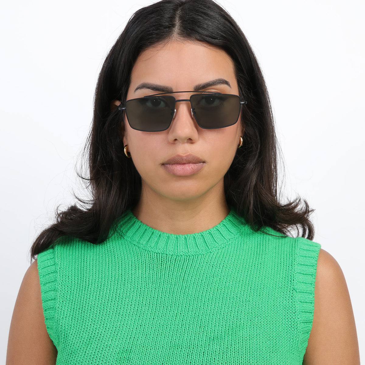 Woman wearing Jane Sunglasses in Matte Black with Olive lenses, Brunette model