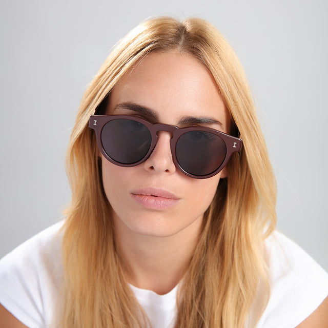 Blonde woman in a white tee wearing Leonard Sunglasses Bordeaux with Grey