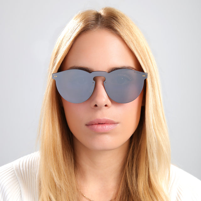 Another angle of blond woman in a white knit tee wearing Leonard Mask Sunglasses Metal with Metal