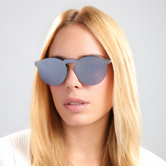 Blond woman in a white knit tee wearing Leonard Mask Sunglasses Metal with Metal