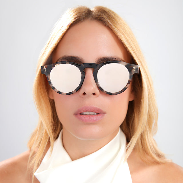Blond woman in a silk white halter top wearing Leonard Sunglasses White Tortoise with Silver Mirror