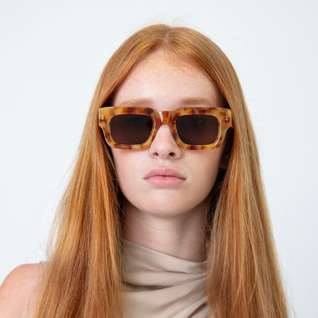 Model with long red hair wearing Lewis Sunglasses Amber with Brown Flat