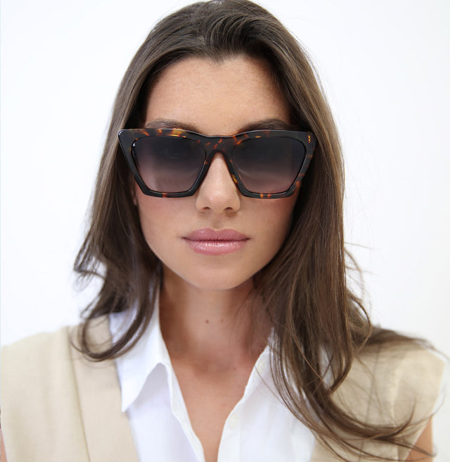 Model with straight brown hair wearing Lisbon Sunglasses Star Tortoise with Grey Gradient