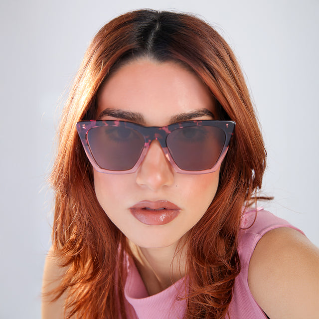 Another angle of woman with red hair in a pink blouse Lisbon Sunglasses side view in Cherry Blossom / Brown