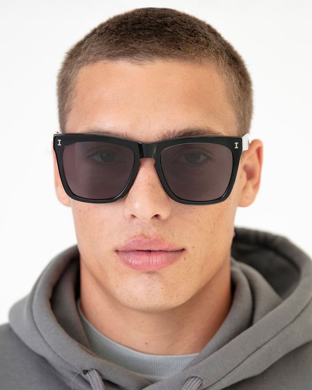 Model with buzzcut wearing Los Feliz Sunglasses Black with Grey
