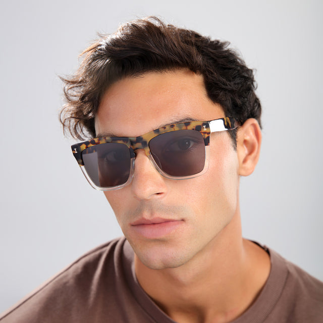 Man in a brown shirt wearing Los Feliz Sunglasses Half Half Tortoise with Grey