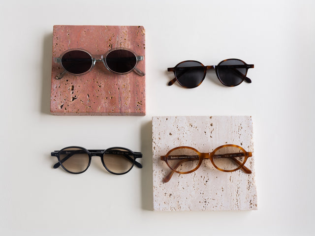 Lugano and Frankfurt Sunglasses displayed near stone slabs