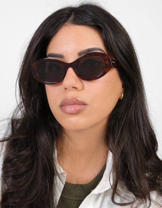 Woman wearing Luna Sunglasses in Havana with Grey Flat lenses