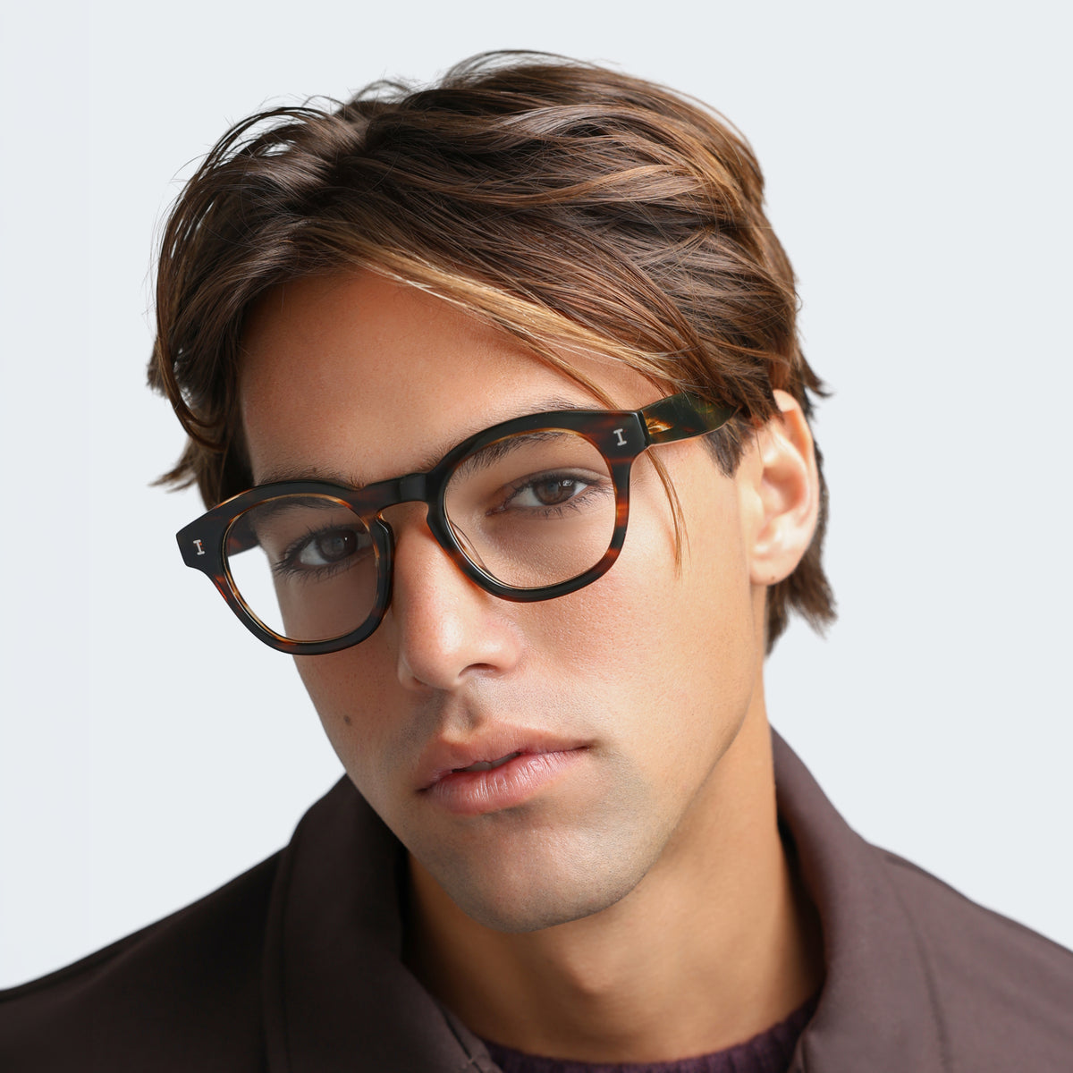 Man wearing Madison Optical in Sand Dune Optical, front view, Another angle of man in a brown jacket