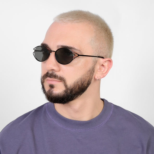 Bearded model looking right wearing Maria Sunglasses Black with Grey