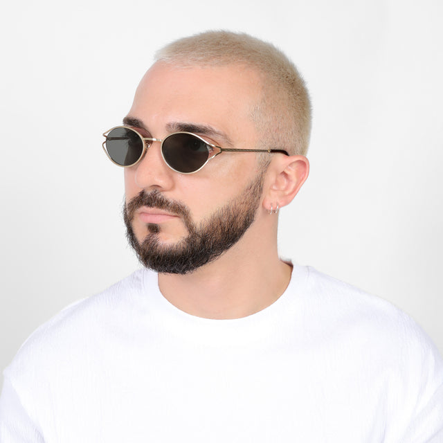 Bearded model looking right wearing Maria Sunglasses Gold with Grey