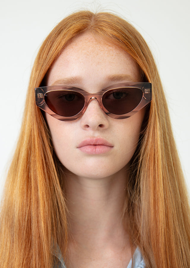 Red Haired Woman wearing Mary Lou 51 Sunglasses Dusty Peach with Brown Flat