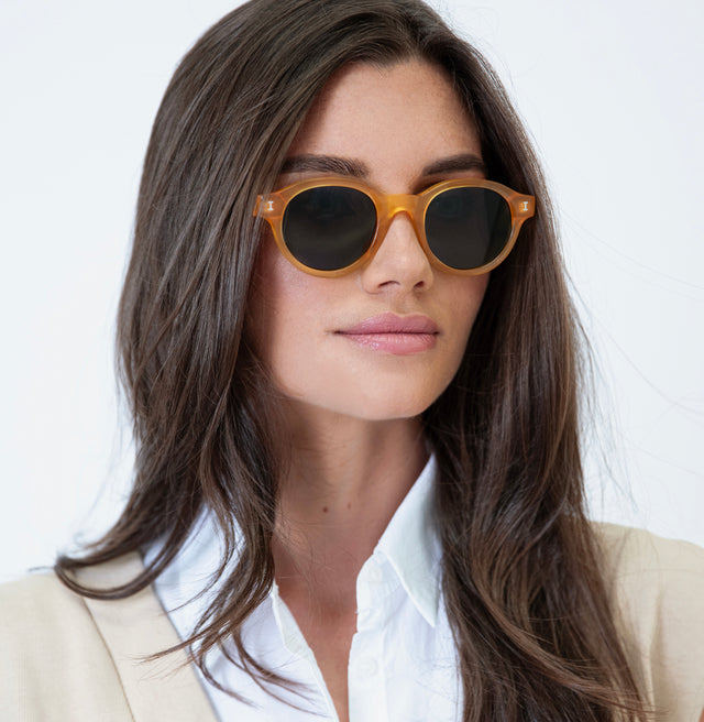 Brunette wearing Medellin Sunglasses Honey Gold with Olive