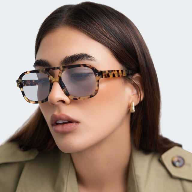 Close up of woman with straight hair wearing Memphis Sunglasses Tortoise with Light Blue See Through