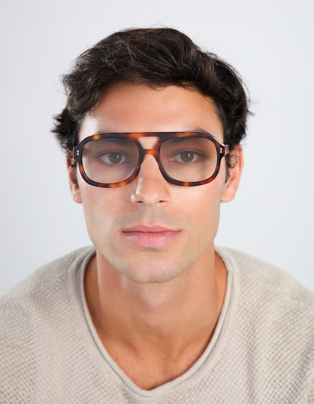 Man in a waffled sweatshirt wearing Memphis Sunglasses in Havana with Taupe Gradient lenses