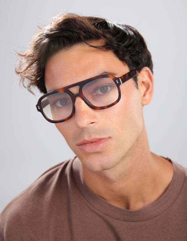 Man in a brown shirt wearing Memphis Sunglasses in Havana with Taupe Gradient lenses