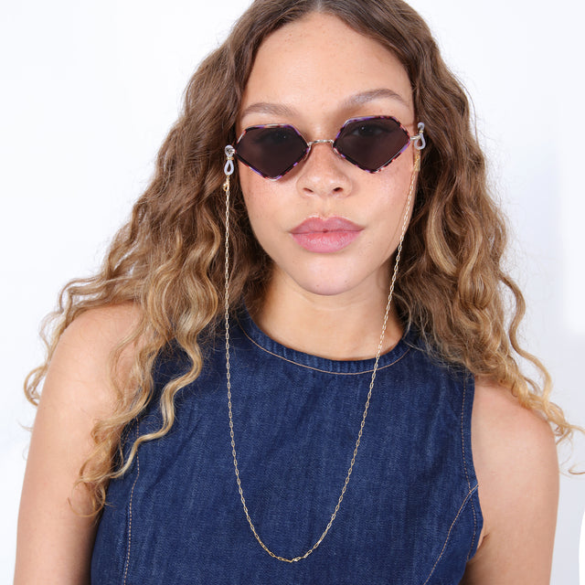 Brunette model with ombré, loose curls wearing Sunglass Chain Micro Paperclip