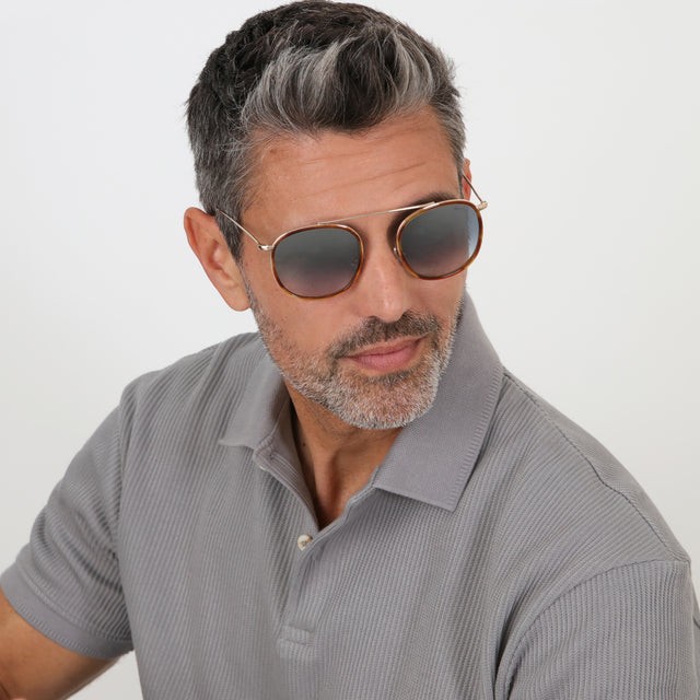 Model with salt and pepper hair and beard wearing Mykonos Ace Sunglasses Saffron Havana/Gold with Silver Flat Mirror Gradient