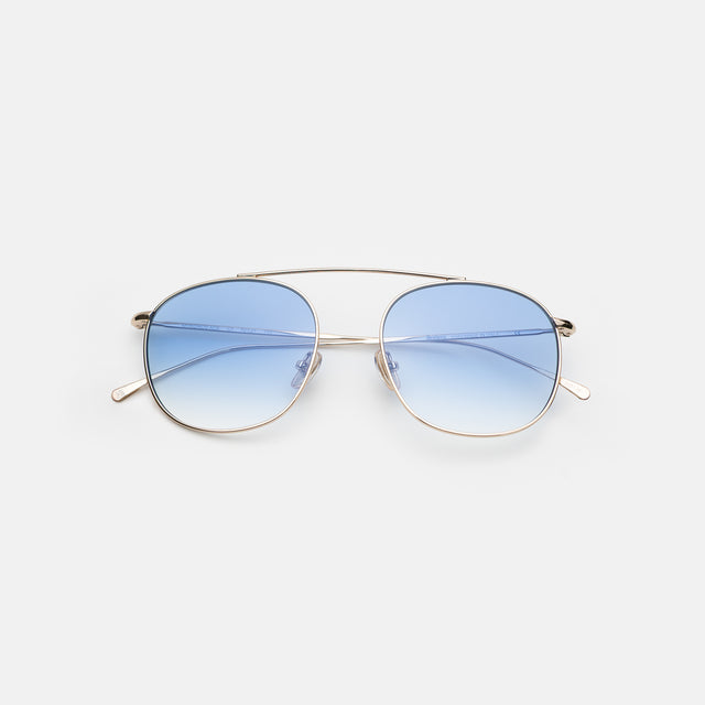 Mykonos M Sunglasses side view in Gold / Blue Flat Gradient See Through