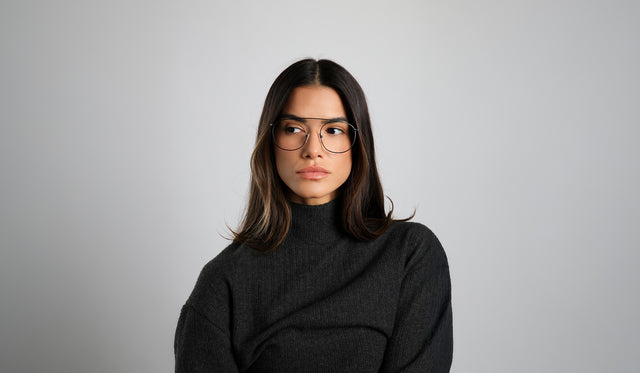 Woman in a cashmere turtleneck wearing Mykonos Optical in Black