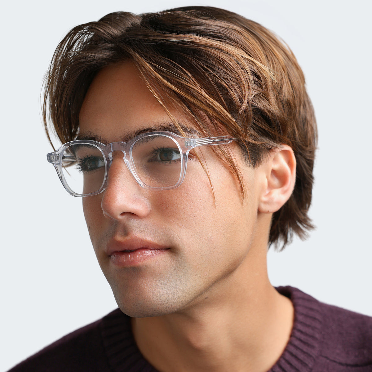Model wearing Nash Optical in Clear Optical, side profile, Close up of man in a plum sweatshirt