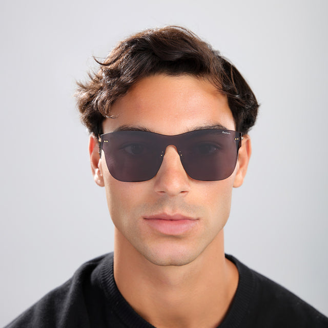 Man in a black shirt wearing Newbury Mask Sunglasses Grey with Grey