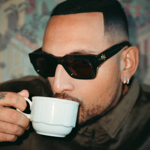 Nick Kyrgios sipping espresso wearing Nick Kyrgios x illesteva 2 Sunglasses Pine with Grey Flat