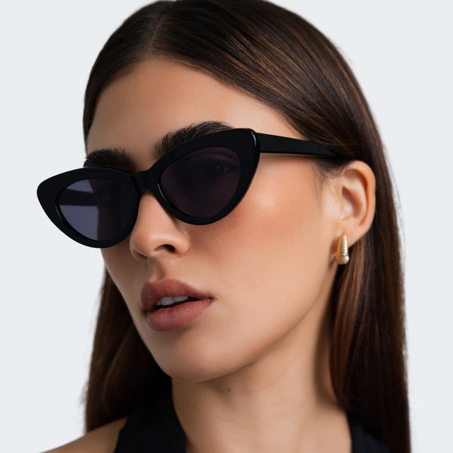 Close up of woman in a black halter blouse wearing Pamela Sunglasses Black with Grey Flat