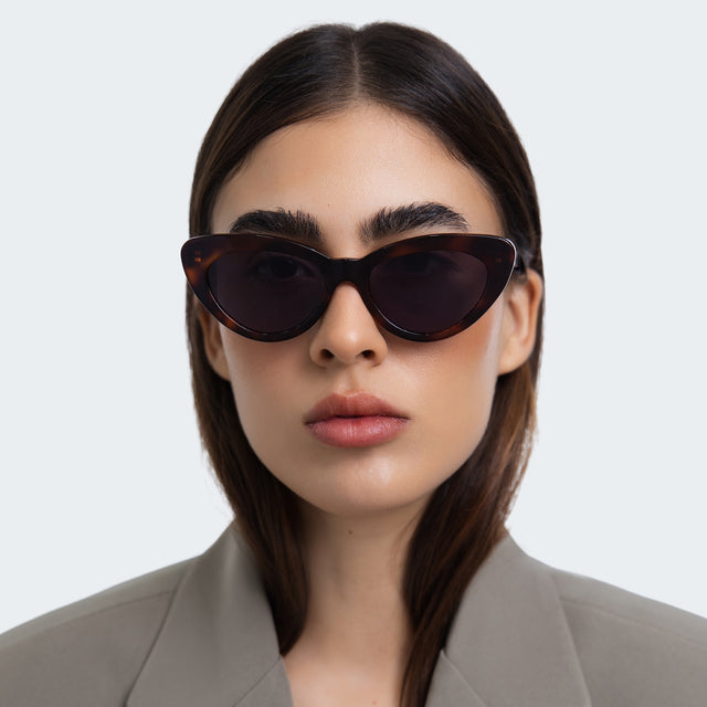 Woman in a grey blazer wearing Pamela Sunglasses Havana with Grey Flat