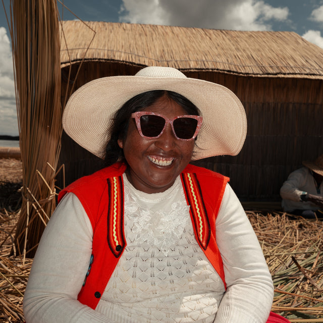 Peruvian woman in a sun hat wearing Barcelona Sunglasses