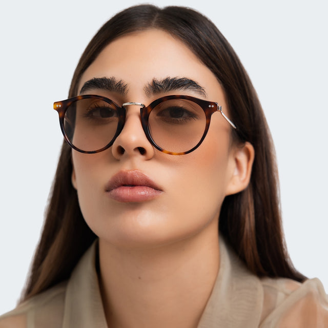 Woman in a trench coat wearing Portofino Sunglasses Havana with Taupe Gradient