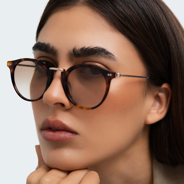 Close up of woman in a trench coat wearing Portofino Sunglasses Havana with Taupe Gradient
