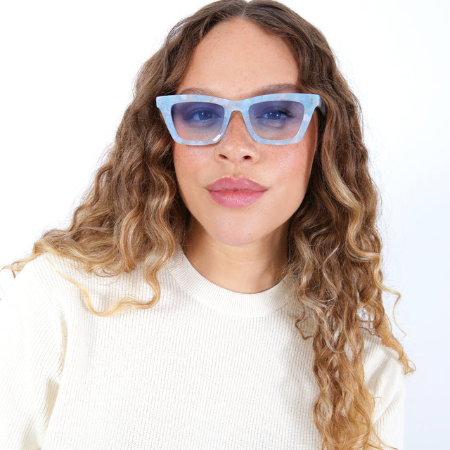 Brunette model with ombré hair Portugal Sunglasses Side Profile in Celeste / Blue Flat Gradient See Through