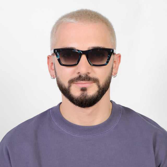 Model with platinum buzzcut wearing Portugal Sunglasses Eclipse with Grey Flat Gradient