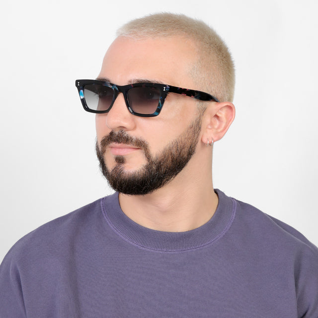 Bearded model looking right wearing Portugal Sunglasses Eclipse with Grey Flat Gradient