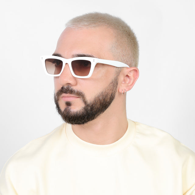 Bearded model looking right wearing Portugal Sunglasses White with Brown Flat Gradient