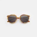 Front view of Puglia Sunglasses in Amber/Rose Gold/Grey Flat
