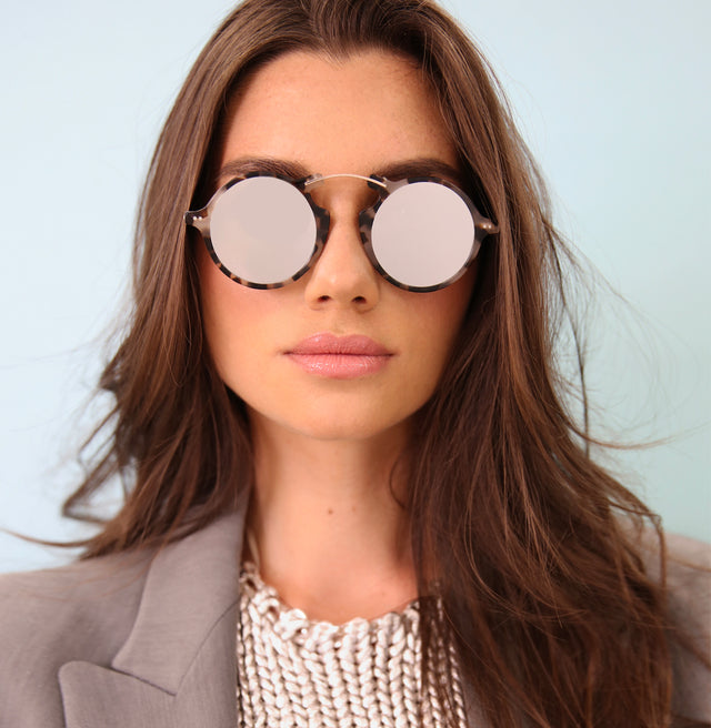 Brunette model with straight hair and a blazer wearing Roma II Sunglasses White Tortoise with Silver Flat Mirror