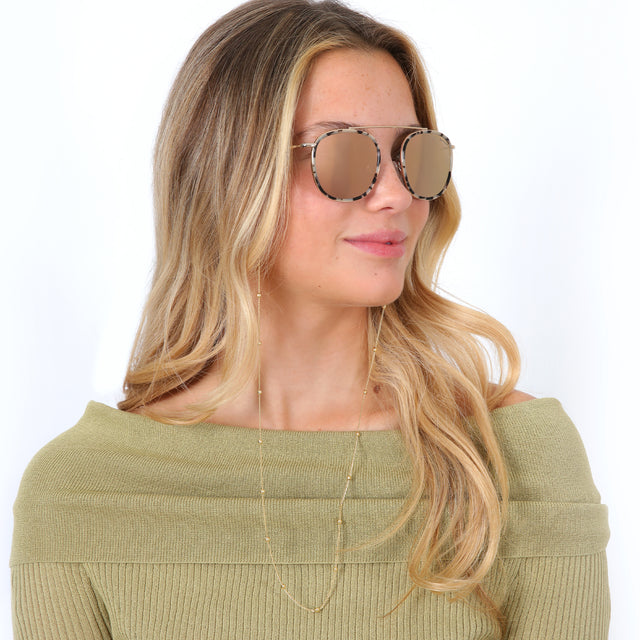 Blonde model with loose curls wearing Sunglass Chain Satellite