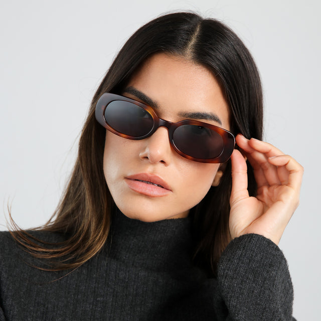 Model in dark gray turtleneck wearing Shirley 51 Sunglasses Havana with Grey