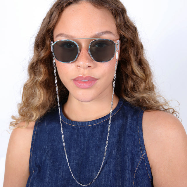 Brunette model with ombré, loose curls wearing Sunglass Chain Silver Link