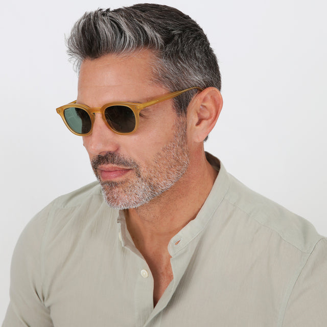 Model with salt and pepper hair and beard wearing Slope Sunglasses Blond with Olive